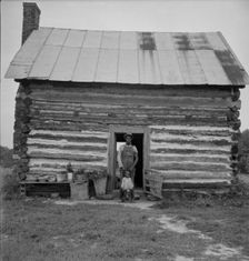 Possibly: Young sharecropper and his first child, Hillside Farm, Person County, North Carolina, 1939 Creator: Dorothea Lange