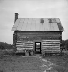 Possibly: Young sharecropper and his first child, Hillside Farm, Person County, North Carolina, 1939 Creator: Dorothea Lange