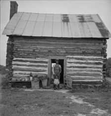 Possibly: Young sharecropper and his first child, Hillside Farm, Person County, North Carolina, 1939 Creator: Dorothea Lange