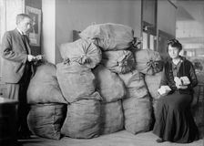 Post Office Department - Dead Letter Mail, Supt. Marvin Mclean And Mrs. Clara R.A. Nelson, 1917. Creator: Harris & Ewing