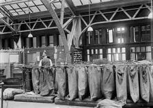 Post Office Department - Mailbags, 1913. Creator: Harris & Ewing
