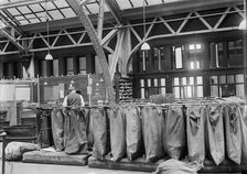 Post Office Department - Mailbags, 1913. Creator: Harris & Ewing