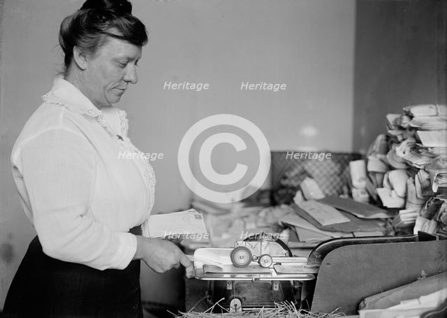 Post Office Department - Sealing Machine, 1917. Creator: Harris & Ewing.