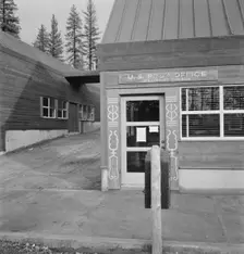 Post office in company lumber town, Gilchrist, Oregon, 1939. Creator: Dorothea Lange