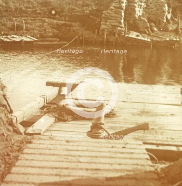 Post on the riverbank, Diksmuide, Belgium c1914-c1918. Artist: Unknown.