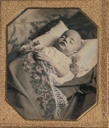 Postmortem Baby, Partially Covered by a Flowered Shawl with a Fringe Hem, 1840s. Creator: Unknown