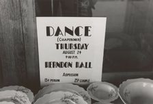Poster in drugstore window, Syracuse, Kansas, 1939-08. Creator: Russell Lee