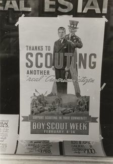 Poster in real estate window, Harlingen, Texas, 1939-02. Creator: Russell Lee