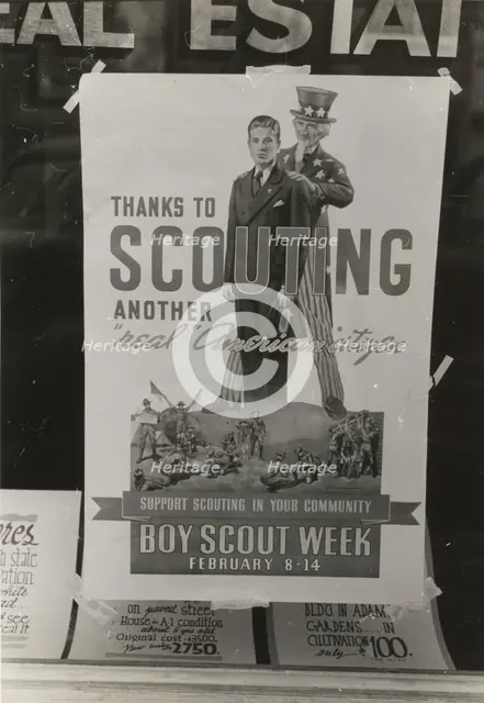 Poster in real estate window, Harlingen, Texas,  1939-02. Creator: Russell Lee.
