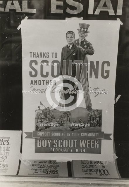 Poster in real estate window, Harlingen, Texas,  1939-02. Creator: Russell Lee.