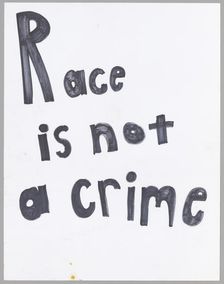 Poster reading "Race is not a crime" used at Baltimore protests, April 2015. Creator: Unknown