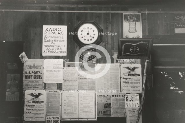 Posters and decorations in combined general store and post office, Olga, Louisiana,  1938-09. Creator: Russell Lee.