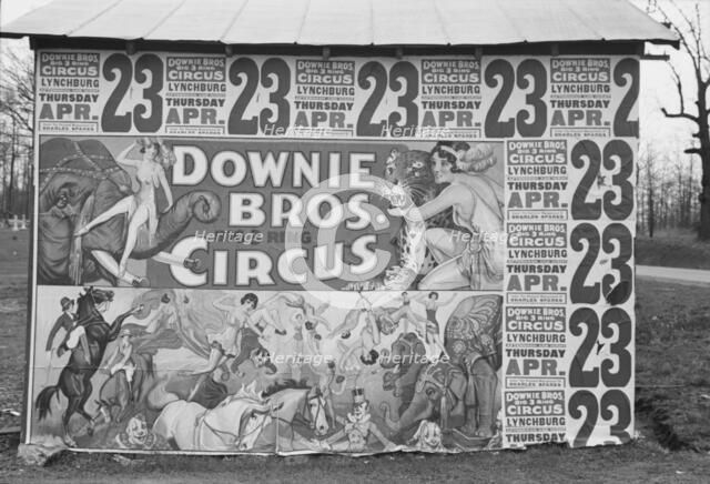 Posters covering a building near Lynchburg to advertise a Downie Bros. circus, 1936. Creator: Walker Evans.