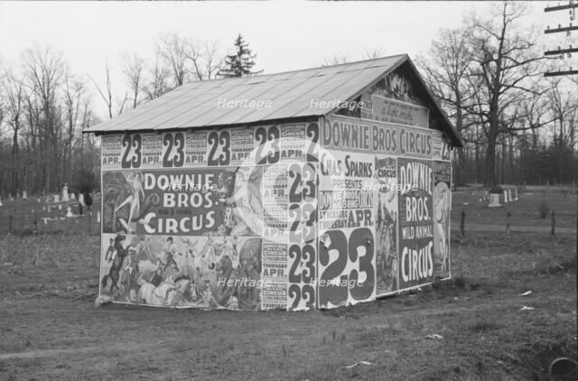 Posters covering a building near Lynchburg to advertise a Downie Bros. circus, 1936. Creator: Walker Evans.