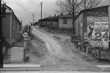 Posters covering a building near Lynchburg to advertise a Downie Bros. circus, 1936. Creator: Walker Evans