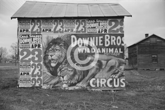 Posters covering a building near Lynchburg to advertise a Downie Bros. circus, 1936. Creator: Walker Evans.