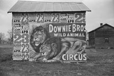 Posters covering a building near Lynchburg to advertise a Downie Bros. circus, 1936. Creator: Walker Evans