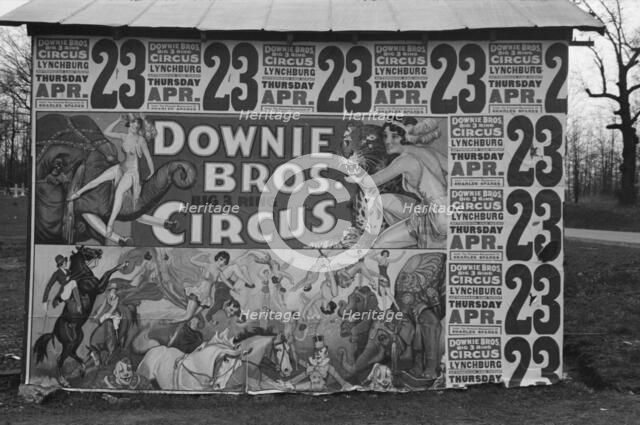 Posters covering a building near Lynchburg to advertise a Downie Bros. circus, 1936. Creator: Walker Evans.