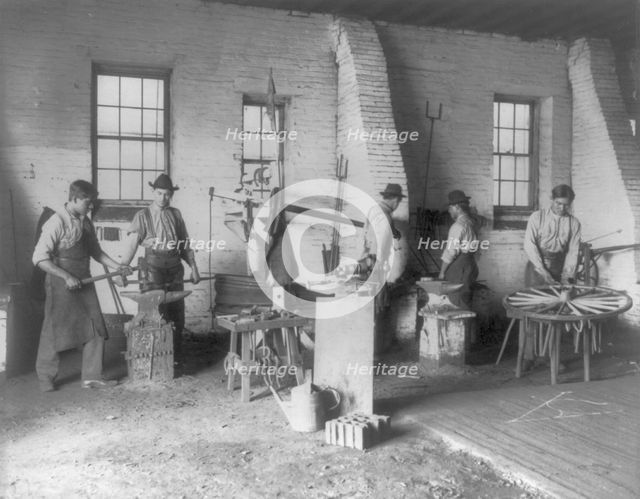 Pa. - Carlisle Indian School - student wheelwrights working in shop, 1901. Creator: Frances Benjamin Johnston.