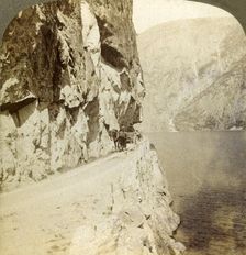 Path blasted out of the towering cliffs for a road around Oifjords Lake, Norway 1905. Creator: Unknown