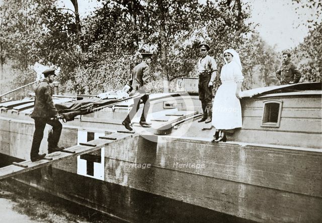 Patients being taken on board a hospital barge, Somme campaign, France, World War I, 1916. Creator: Unknown.