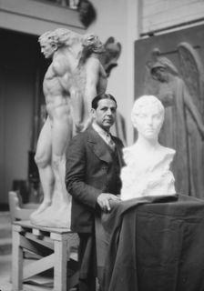Patigian, Haig, Mr., with his sculptures, portrait photograph, 1927 Creator: Arnold Genthe