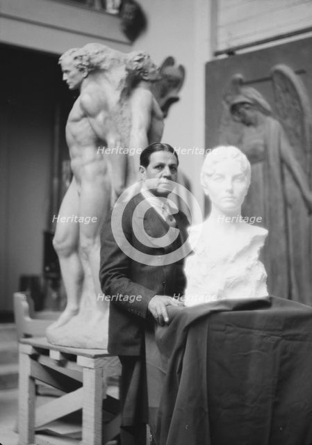 Patigian, Haig, Mr., with his sculptures, portrait photograph, 1927 Creator: Arnold Genthe.