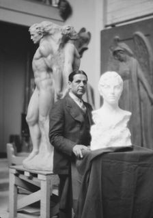 Patigian, Haig, Mr., with his sculptures, portrait photograph, 1927 Creator: Arnold Genthe