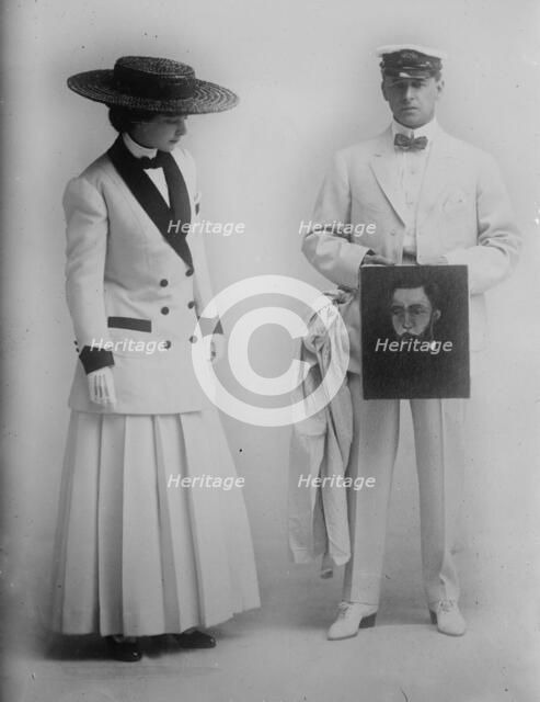 Paula Marr and Wm. Collier holding picture, 1910. Creator: Bain News Service.