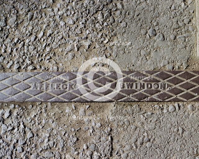 Pavement rainwater gully cover plate made by Affleck of Swindon, Swindon, Wiltshire, 2006. Artist: Peter Williams.