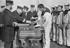 Pay day on board HMS Royal Sovereign 1895. Artist: Gregory & Co