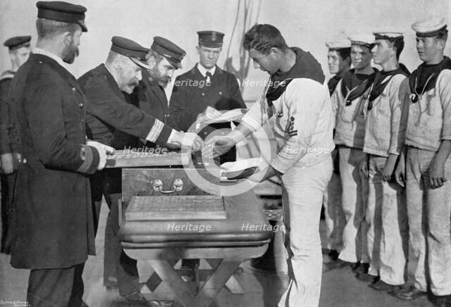 Pay day on board HMS 'Royal Sovereign', 1895. Artist: Gregory & Co