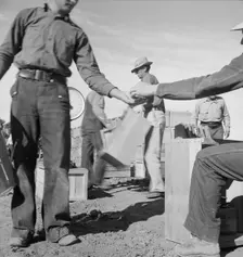 Paymaster on edge of pea fields pays a...,near Calipatria, Imperial Valley, CA, 1939. Creator: Dorothea Lange