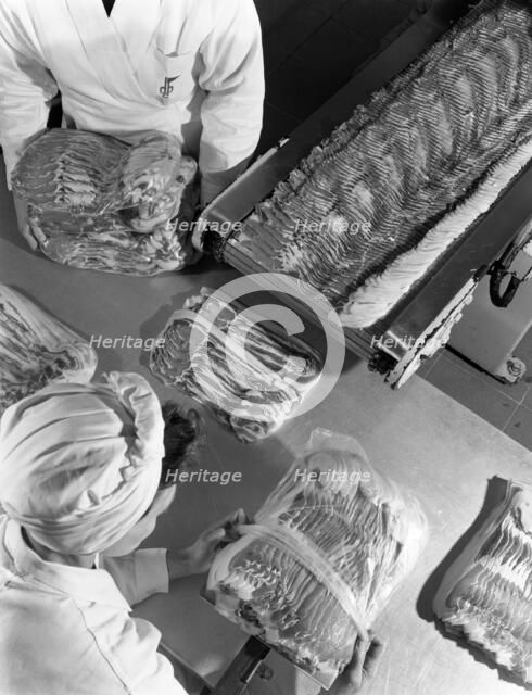 Packing bacon rashers, Danish Bacon Company, Selby, North Yorkshire, 1964. Artist: Michael Walters