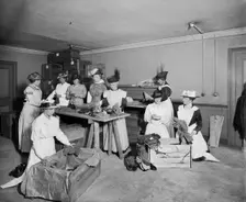 Packing socks for the troops, Westminster Palace Hotel, Westminster, London, 1915. Artist: H Bedford Lemere