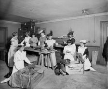 Packing socks for the troops, Westminster Palace Hotel, Westminster, London, 1915. Artist: H Bedford Lemere