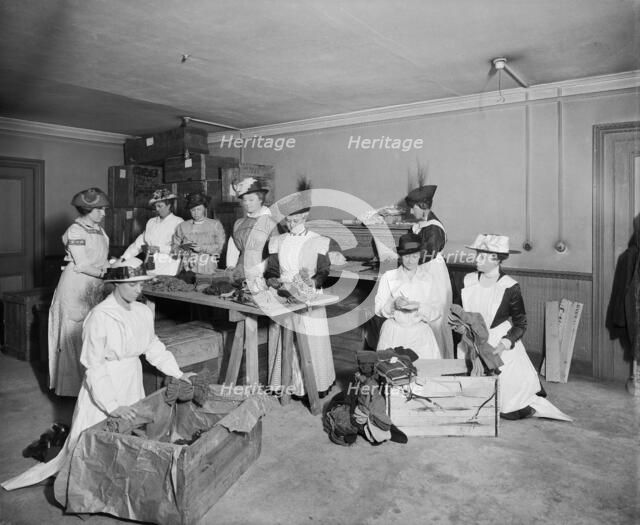 Packing socks for the troops, Westminster Palace Hotel, Westminster, London, 1915. Artist: H Bedford Lemere.