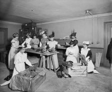 Packing socks for the troops, Westminster Palace Hotel, Westminster, London, 1915. Artist: H Bedford Lemere