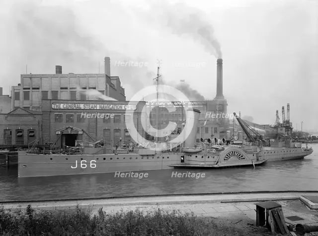 Paddle steamer under arms, Deptford Creek, London, 1940. Creator: Larkin Bros.