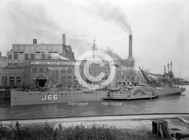 Paddle steamer under arms, Deptford Creek, London, 1940. Creator: Larkin Bros.