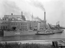 Paddle steamer under arms, Deptford Creek, London, 1940. Creator: Larkin Bros