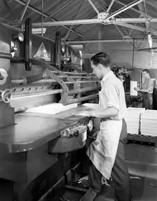 Page cutting guillotine in use at a South Yorkshire printing company, 1959. Creator: Michael Walters