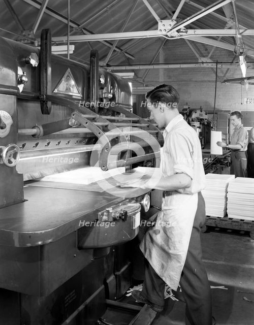 Page cutting guillotine in use at a South Yorkshire printing company, 1959.  Artist: Michael Walters