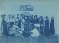 Pageant participants costumed as Pilgrims and Natives, posed beneath a banner "En..., c1880 - 1900. Creator: Frances Benjamin Johnston
