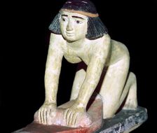 Painted figure of an Egyptian servant making bread