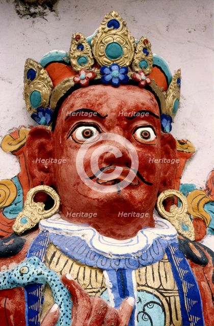 Painted relief of a deity, monastery, Ladakh, India, 1988. Creator: Amanda Waite.