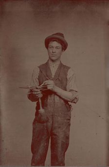 Painter Holding Palette and Brushes, 1870s. Creator: Unknown