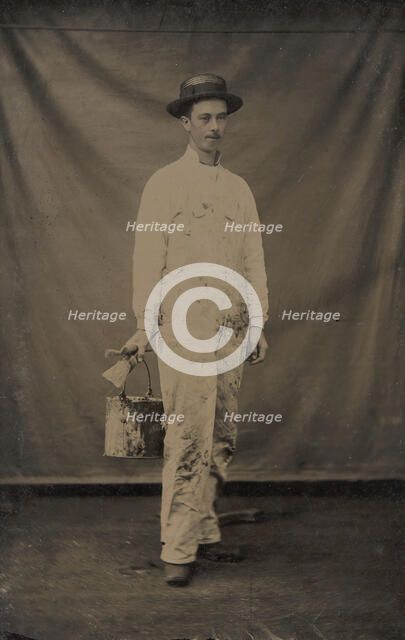 Painter in Paint-spattered Overalls with Brushes and Paint Can, 1870s-80s. Creator: Unknown.