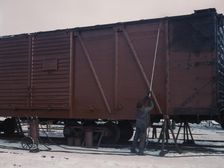 Painting a car at the repair or "rip" tracks at North Proviso(?), C & NW RR, Chicago, Ill., 1942. Creator: Jack Delano