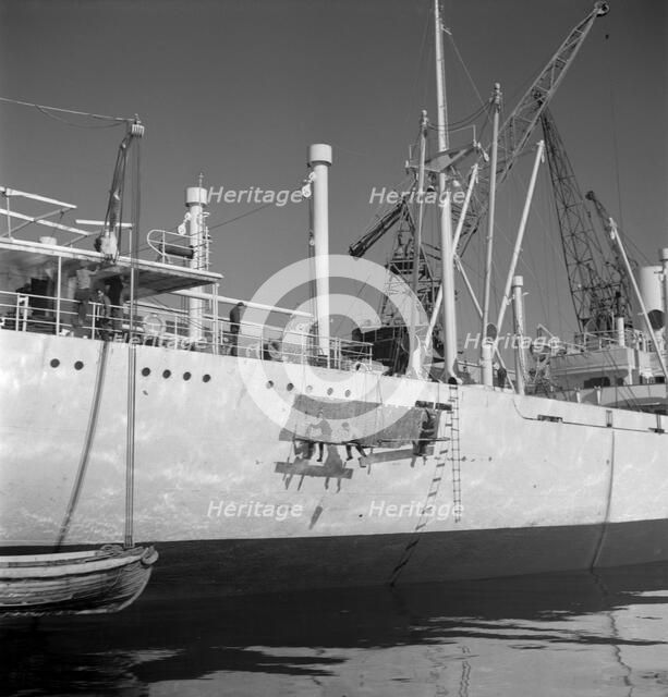 Painting the hull of a ship in the harbour of Gothenburg, Sweden, 1960. Artist: Torkel Lindeberg
